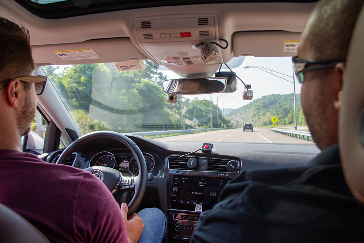 Two people in a VTTI vehicle